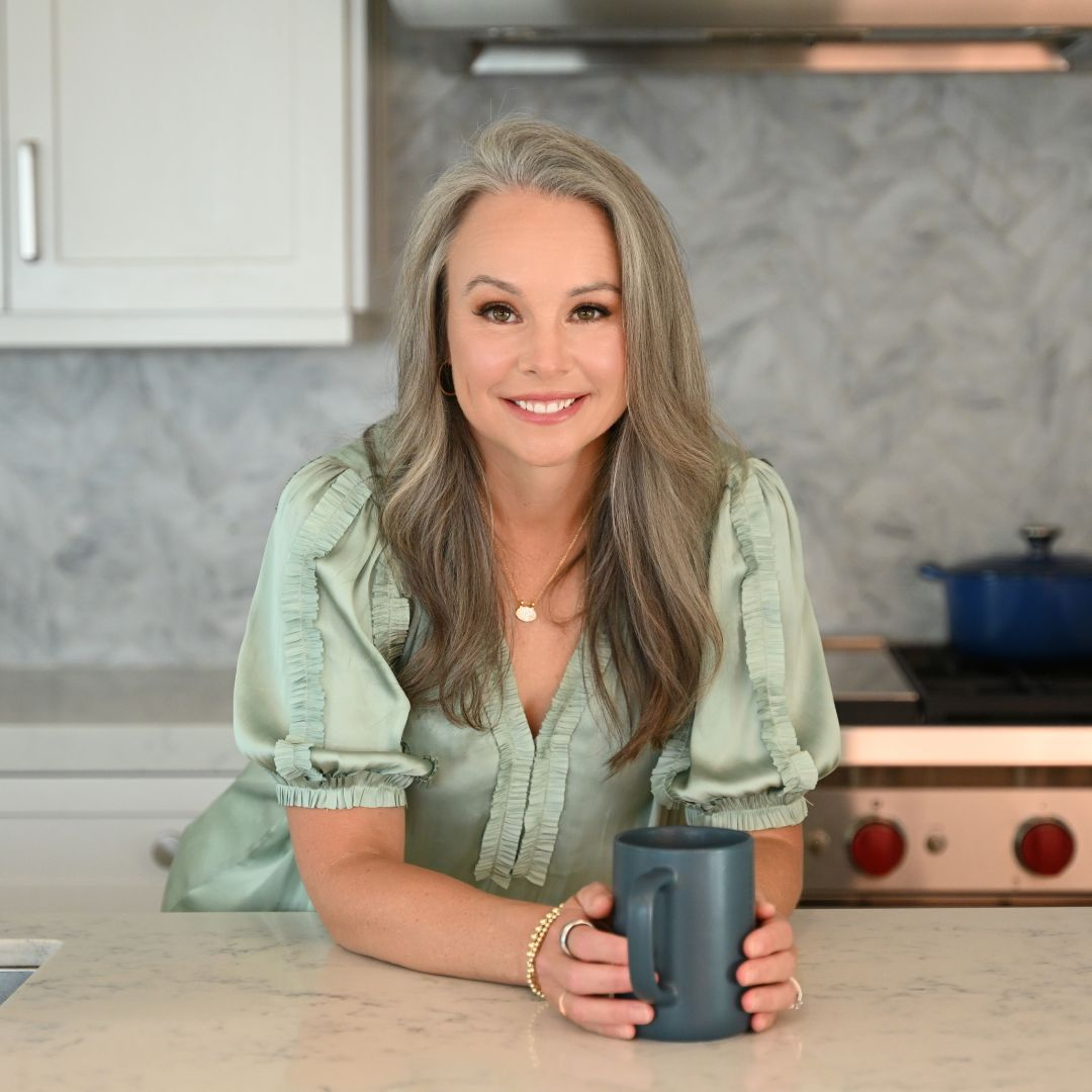 Smaller Corry Corry with coffee cup in kitchen